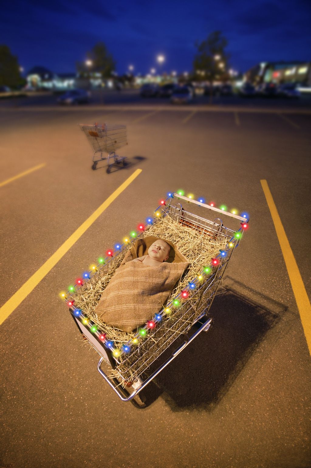 Parking lot with Baby Jesus in shopping cart